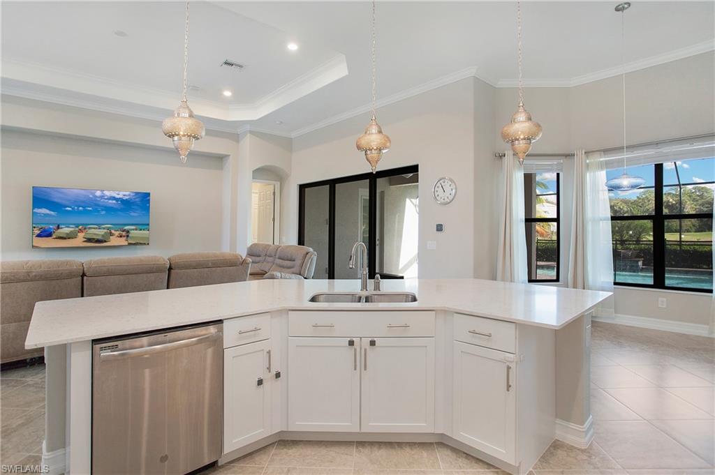 2247 Somerset Place Naples, FL 34120 - Photo 10 of 35 a bathroom with a sink vanity and mirror