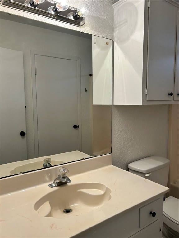 4042 Laguna Shores Road Corpus Christi, TX 78418 - Photo 17 of 25 a bathroom with a sink and a mirror