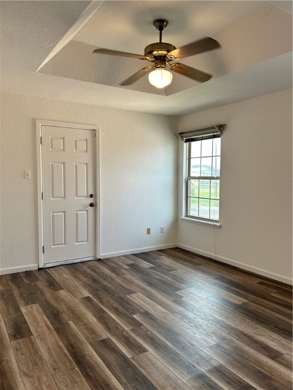 4042 Laguna Shores Road Corpus Christi, TX 78418 - Photo 18 of 25 an empty room with wooden floor fan and windows