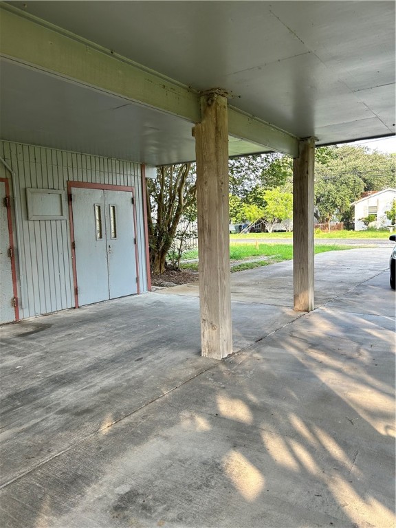 4042 Laguna Shores Road Corpus Christi, TX 78418 - Photo 25 of 25 a view of a porch with a floor to ceiling window
