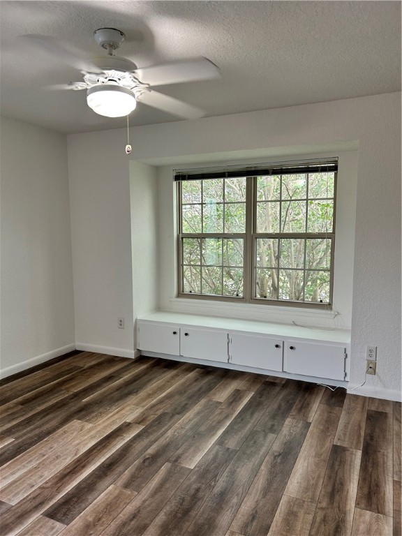 4042 Laguna Shores Road Corpus Christi, TX 78418 - Photo 10 of 25 a view of an empty room with chandelier fan and fire place