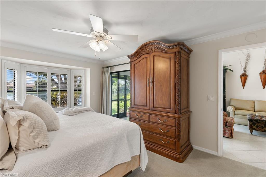 3346 Erick Lake Drive, Unit 2001 Naples, FL 34109 - Photo 14 of 43 a bedroom with a bed and a window