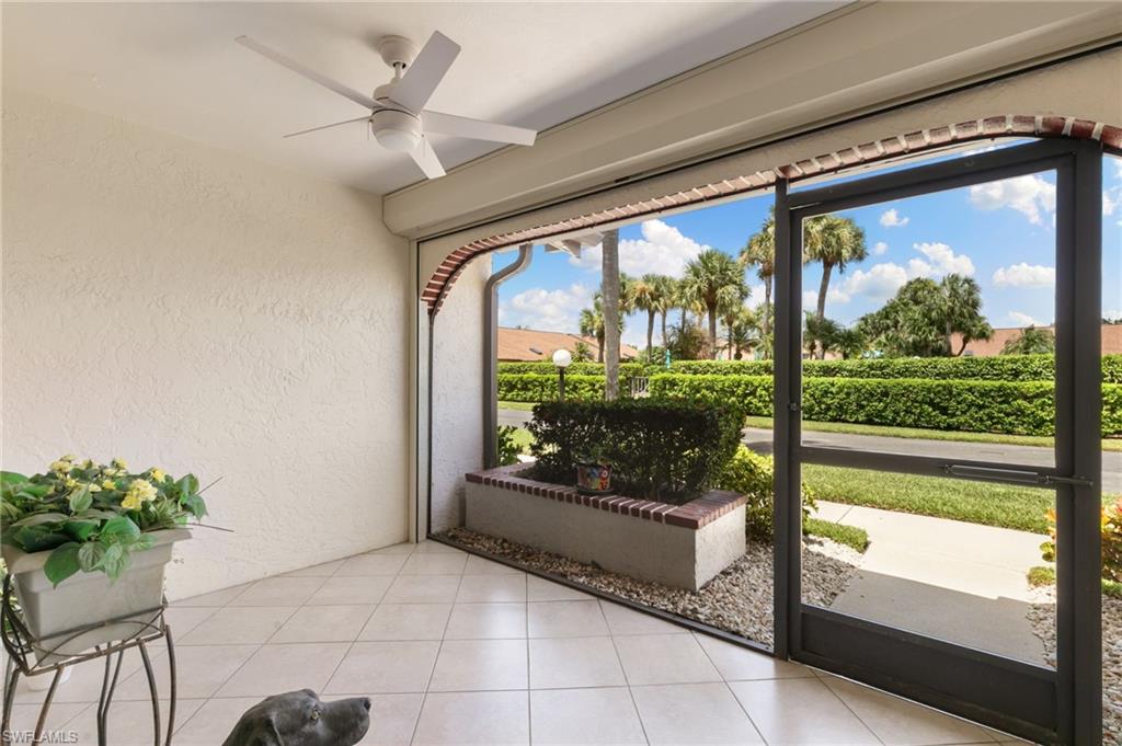 3346 Erick Lake Drive, Unit 2001 Naples, FL 34109 - Photo 2 of 43 a living room with a large window