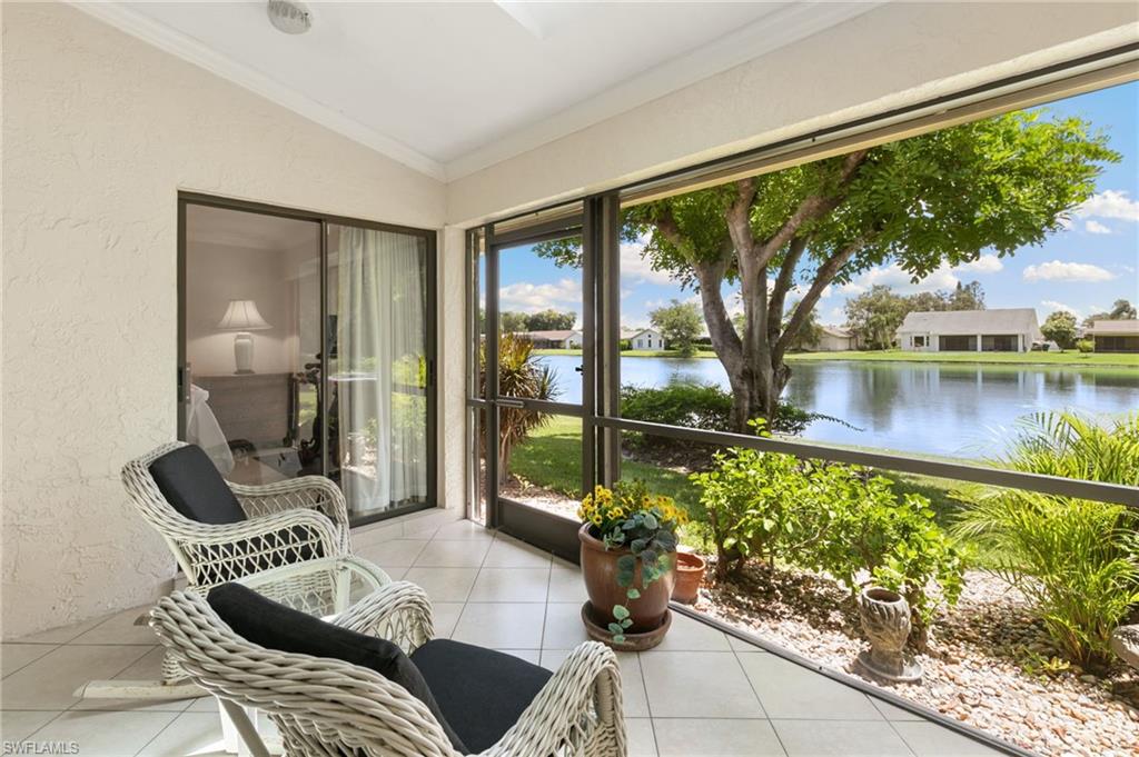 3346 Erick Lake Drive, Unit 2001 Naples, FL 34109 - Photo 25 of 43 a living room with furniture and a large window