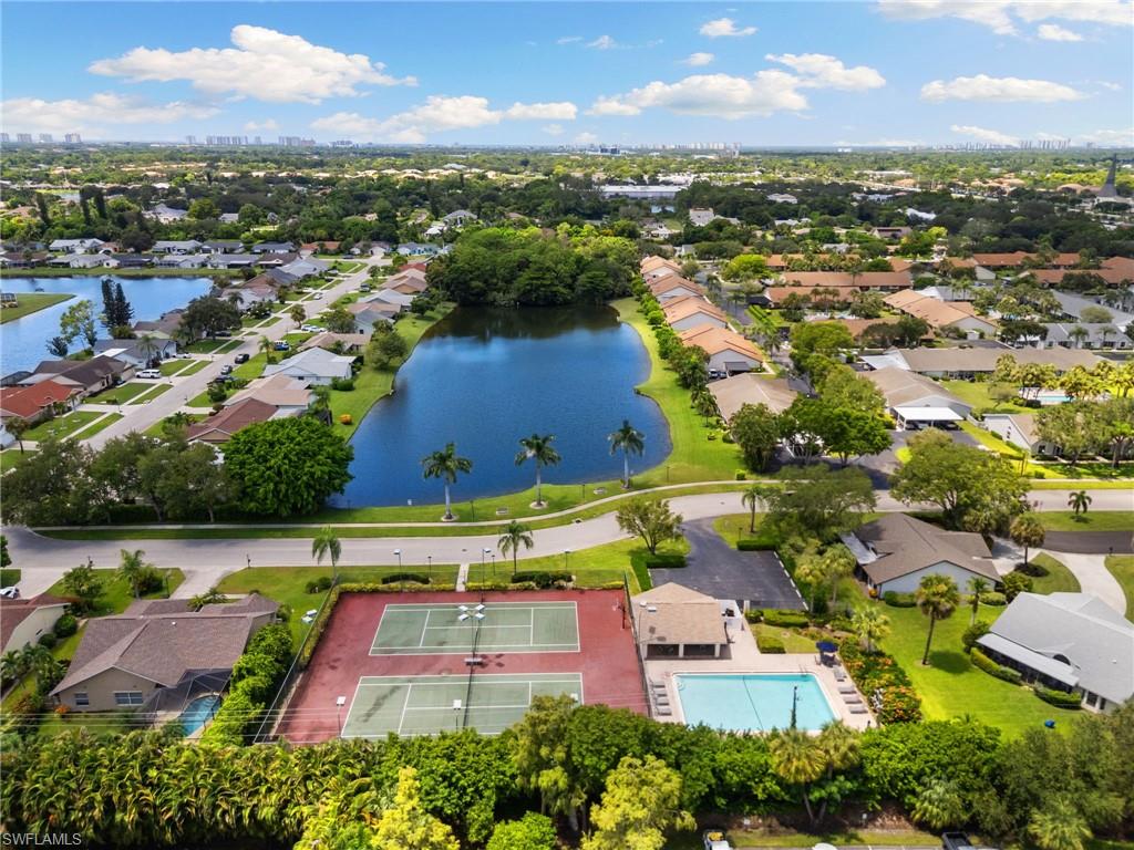 3346 Erick Lake Drive, Unit 2001 Naples, FL 34109 - Photo 36 of 43 an aerial view of residential houses with outdoor space and river