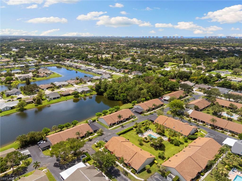 3346 Erick Lake Drive, Unit 2001 Naples, FL 34109 - Photo 40 of 43 an aerial view of residential houses with outdoor space