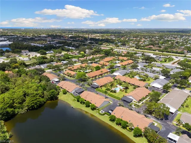 an aerial view of city and lake