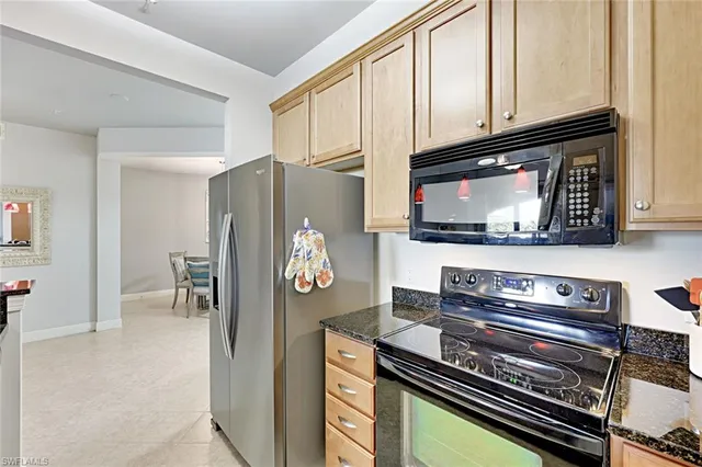 a kitchen with a stove and a microwave