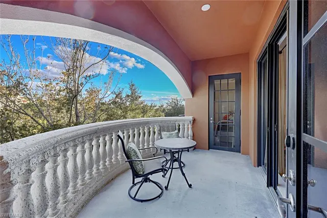 a view of two chairs in the balcony