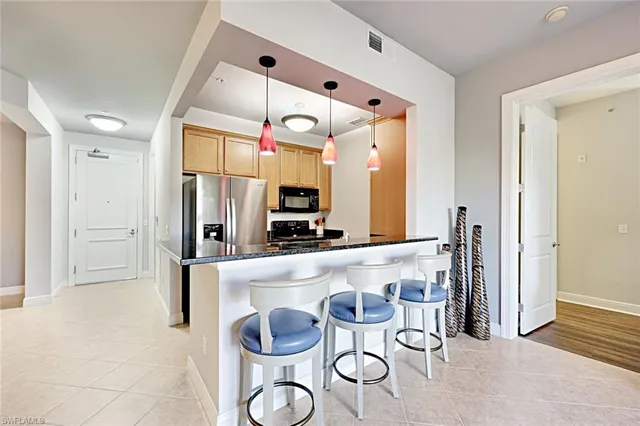 a kitchen with a table and chairs
