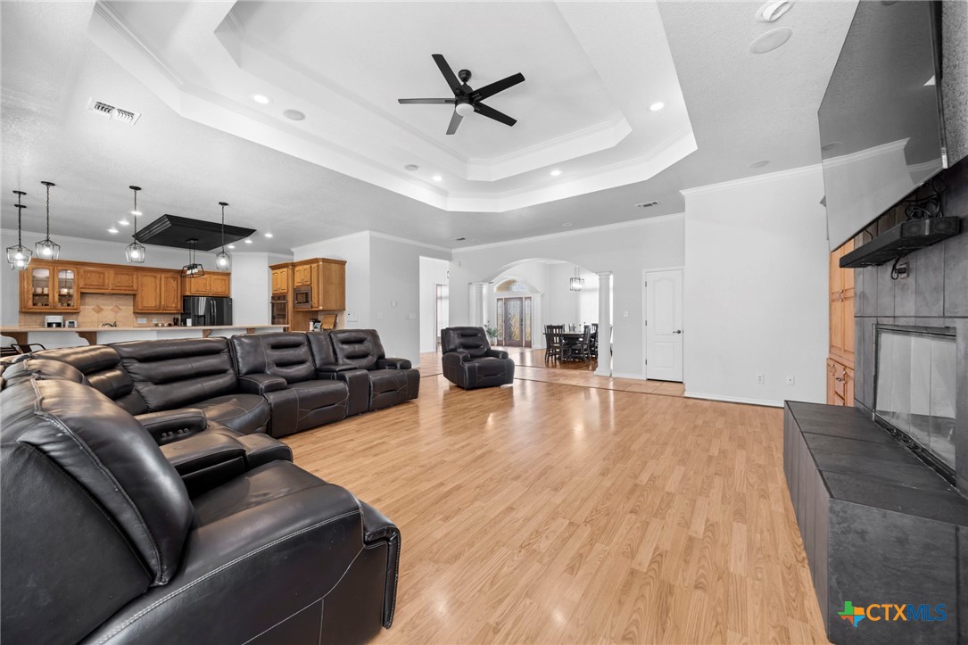 2383 Pecan Creek Road Killeen, TX 76549 - Photo 12 of 39 a living room with furniture kitchen view and a chandelier