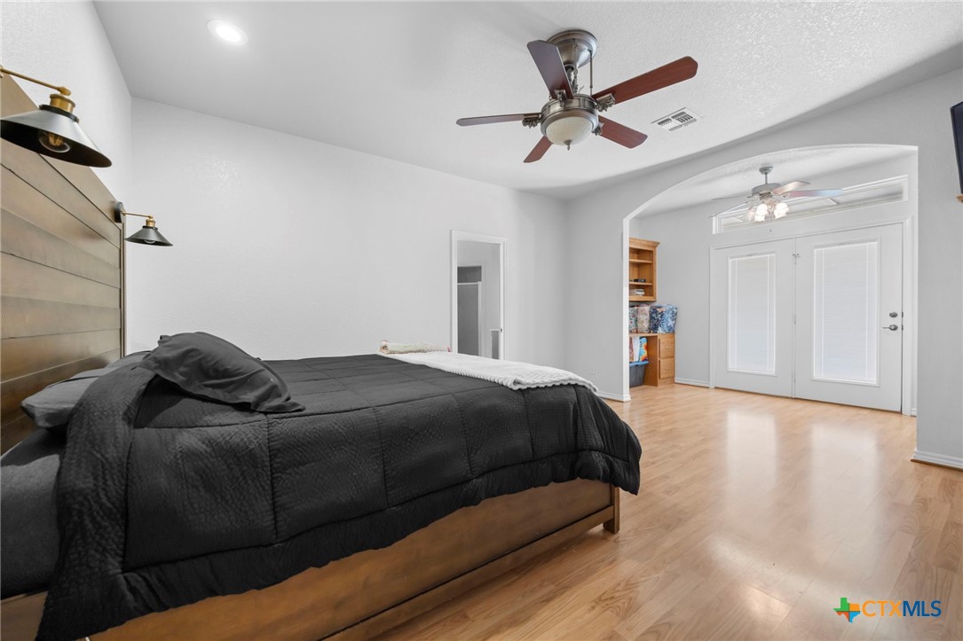 2383 Pecan Creek Road Killeen, TX 76549 - Photo 23 of 39 a bedroom with a bed and a ceiling fan