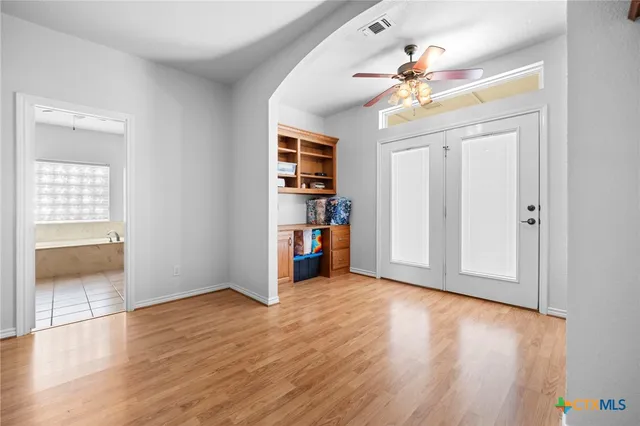 a bathroom with a sink vanity and mirror