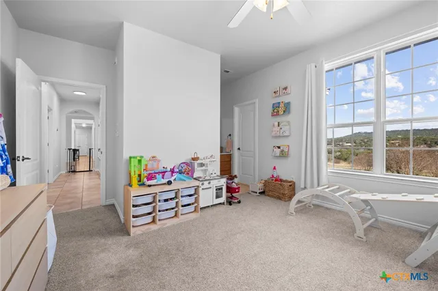 a view of a livingroom with furniture and a flat screen tv