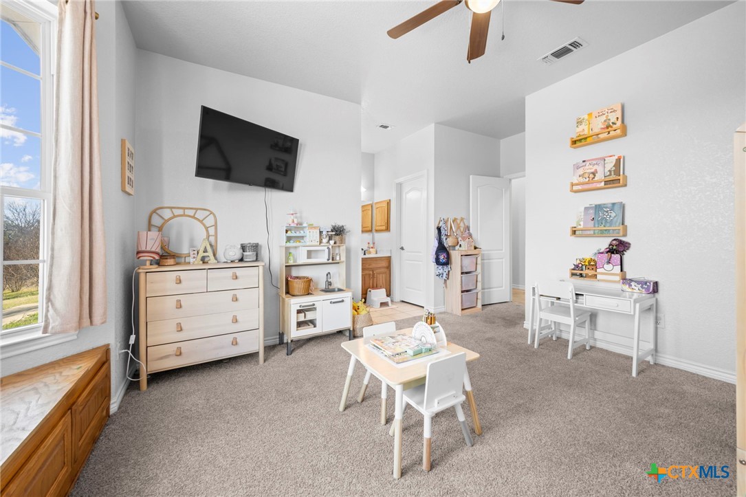 2383 Pecan Creek Road Killeen, TX 76549 - Photo 30 of 39 a view of a livingroom with furniture and a flat screen tv