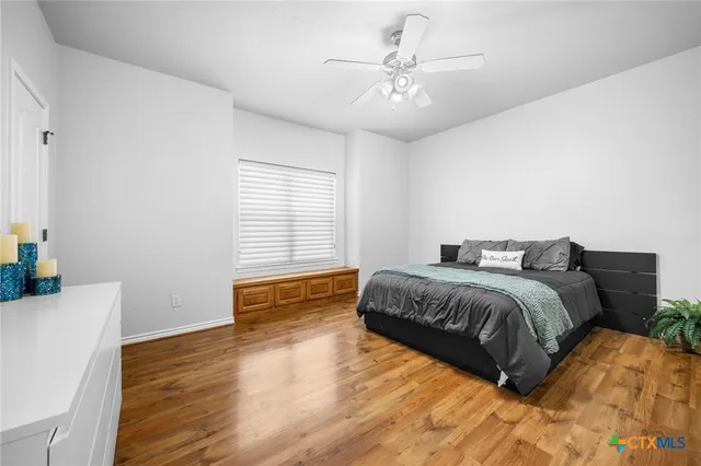 a kitchen with a sink a stove and cabinets