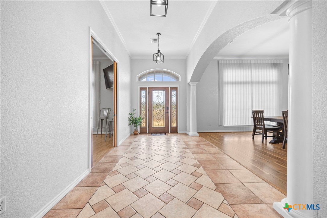 2383 Pecan Creek Road Killeen, TX 76549 - Photo 6 of 39 a view of a room with windows and wooden floor