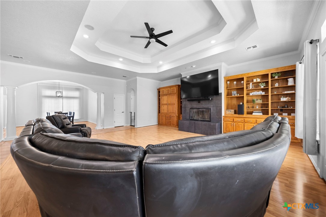 2383 Pecan Creek Road Killeen, TX 76549 - Photo 10 of 39 a living room with fireplace furniture and a flat screen tv