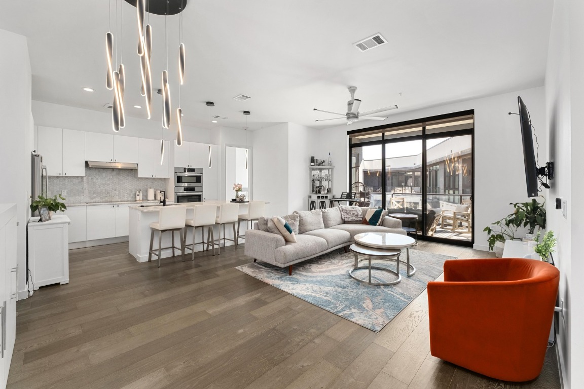800 Embassy Drive, Unit 609 Austin, TX 78702 - Photo 1 of 33 a living room with furniture and a large window