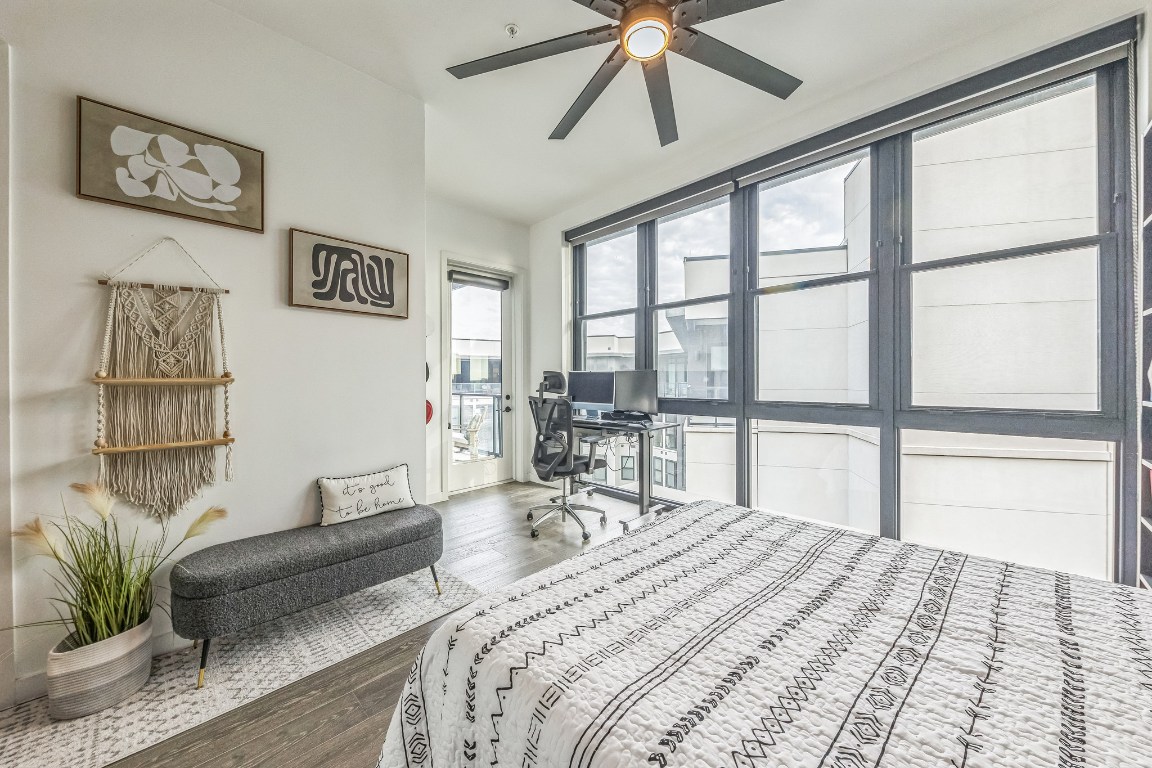 800 Embassy Drive, Unit 609 Austin, TX 78702 - Photo 15 of 33 a bedroom with furniture and a large window