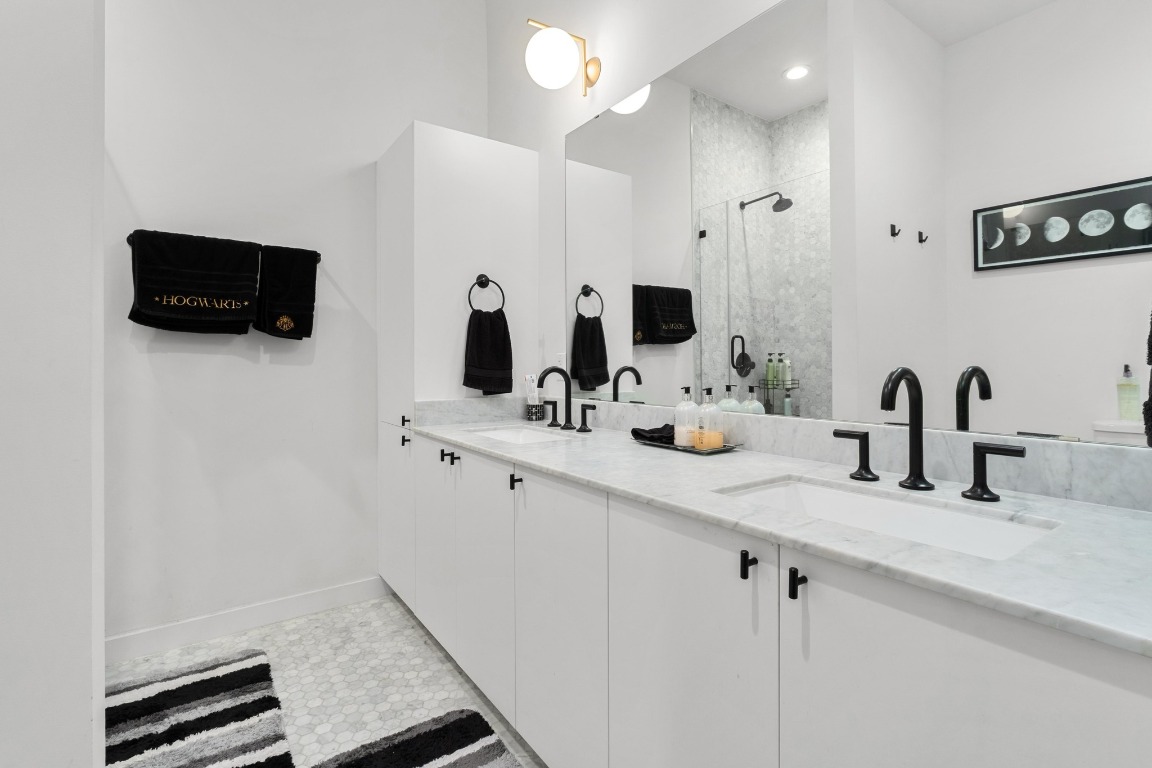 800 Embassy Drive, Unit 609 Austin, TX 78702 - Photo 17 of 33 a kitchen with a sink and a flat screen tv