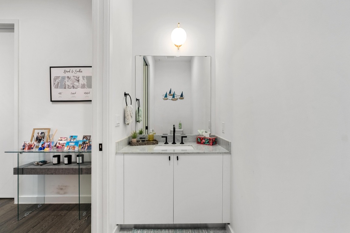 800 Embassy Drive, Unit 609 Austin, TX 78702 - Photo 18 of 33 a bathroom with a sink and a mirror