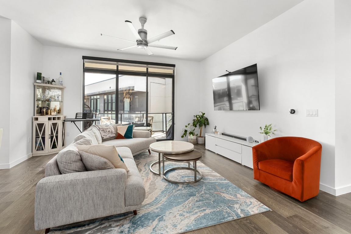 800 Embassy Drive, Unit 609 Austin, TX 78702 - Photo 2 of 33 a living room with furniture and a large window