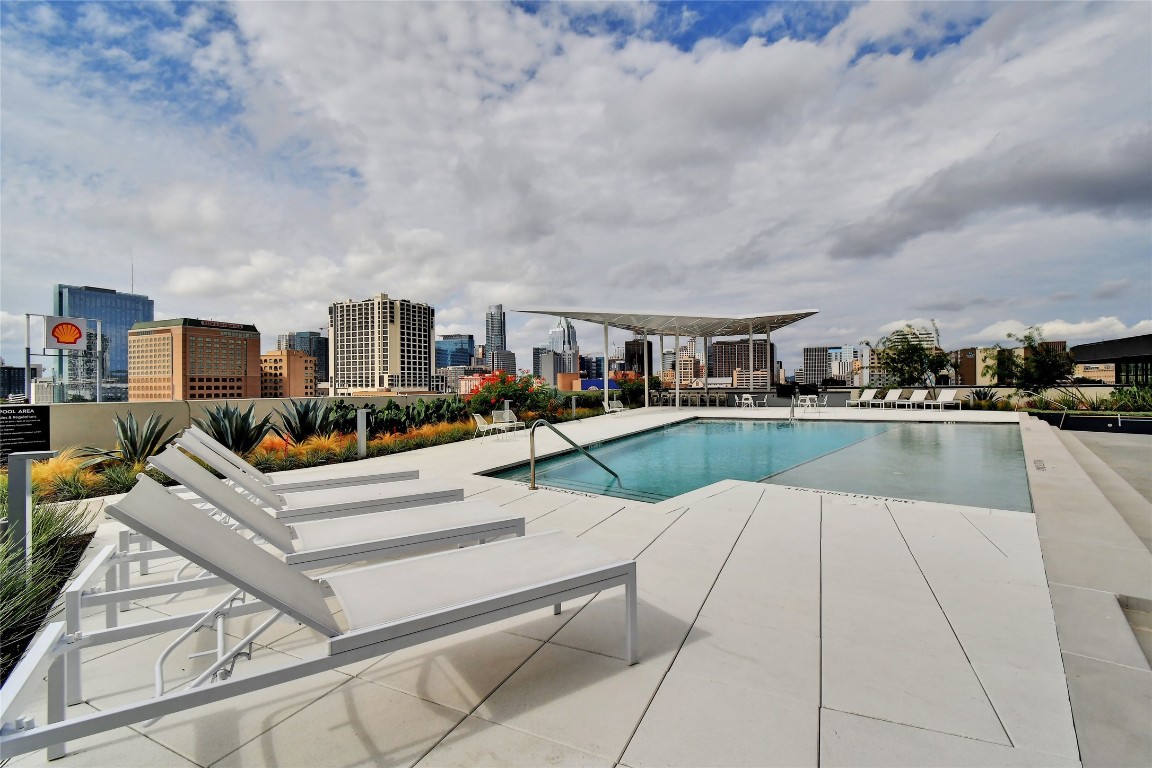 800 Embassy Drive, Unit 609 Austin, TX 78702 - Photo 23 of 33 a view of a house with swimming pool and sitting area