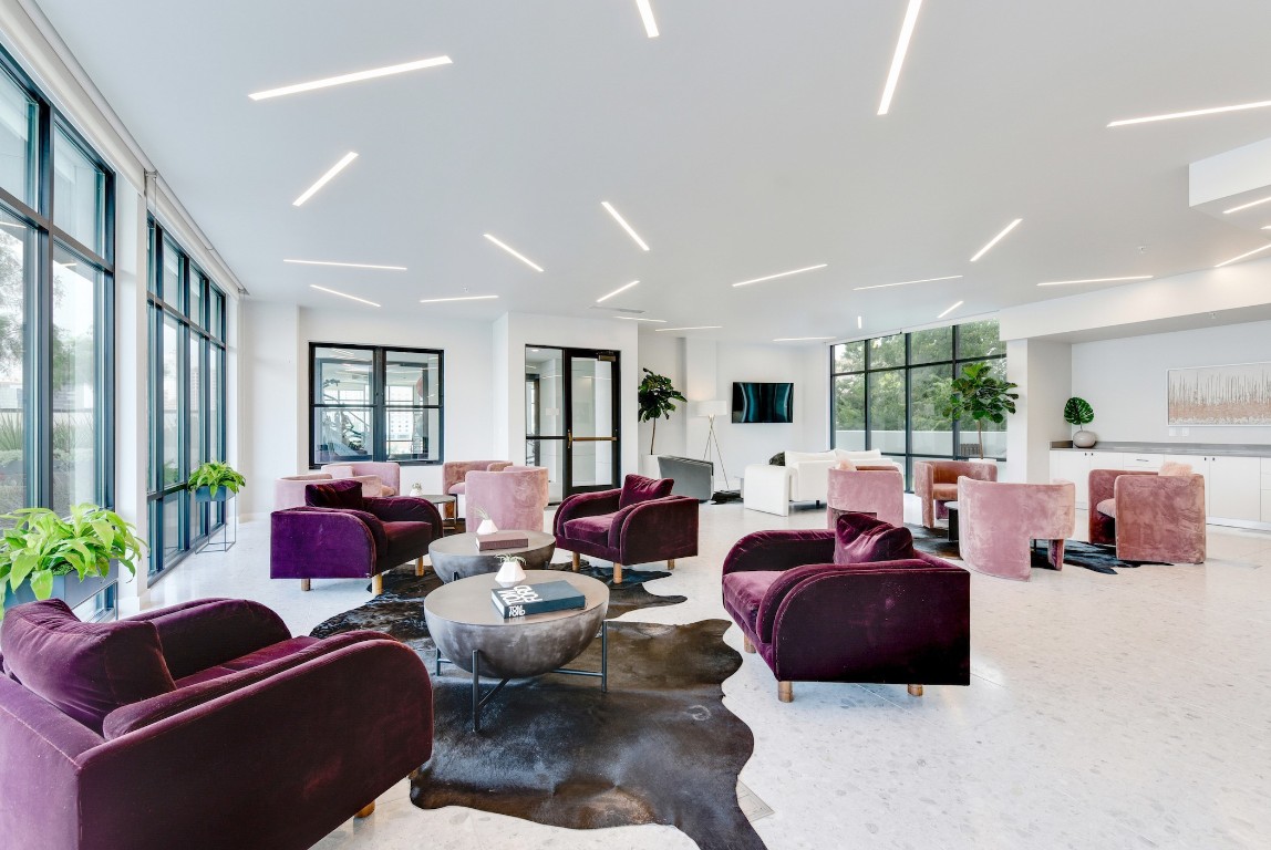 800 Embassy Drive, Unit 609 Austin, TX 78702 - Photo 27 of 33 a living room with furniture ceiling fan and a window