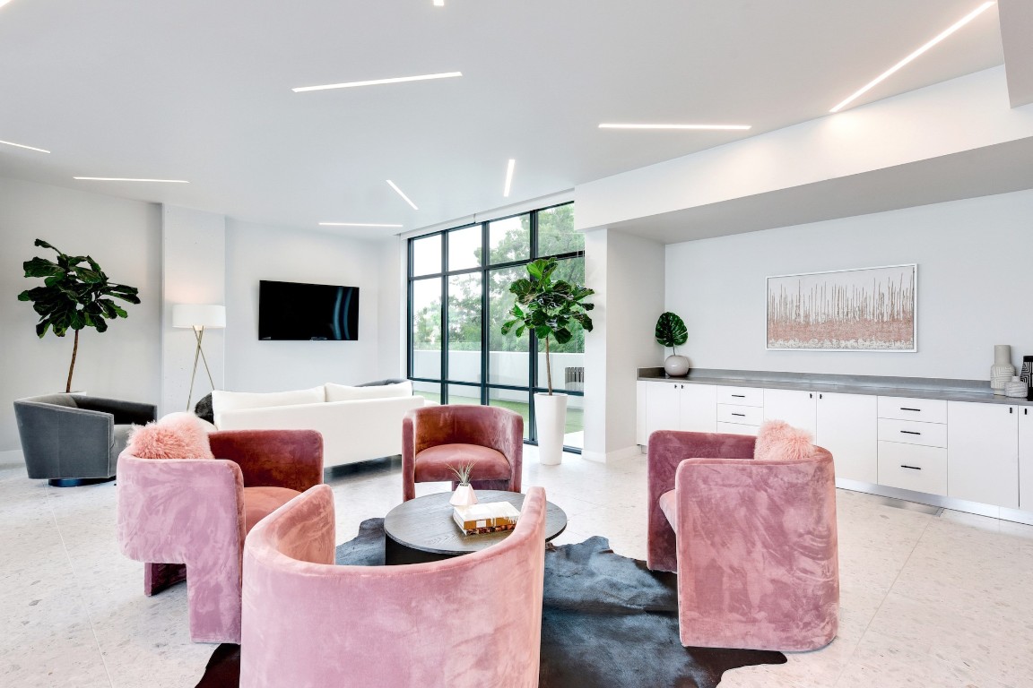 800 Embassy Drive, Unit 609 Austin, TX 78702 - Photo 28 of 33 a living room with furniture and a flat screen tv