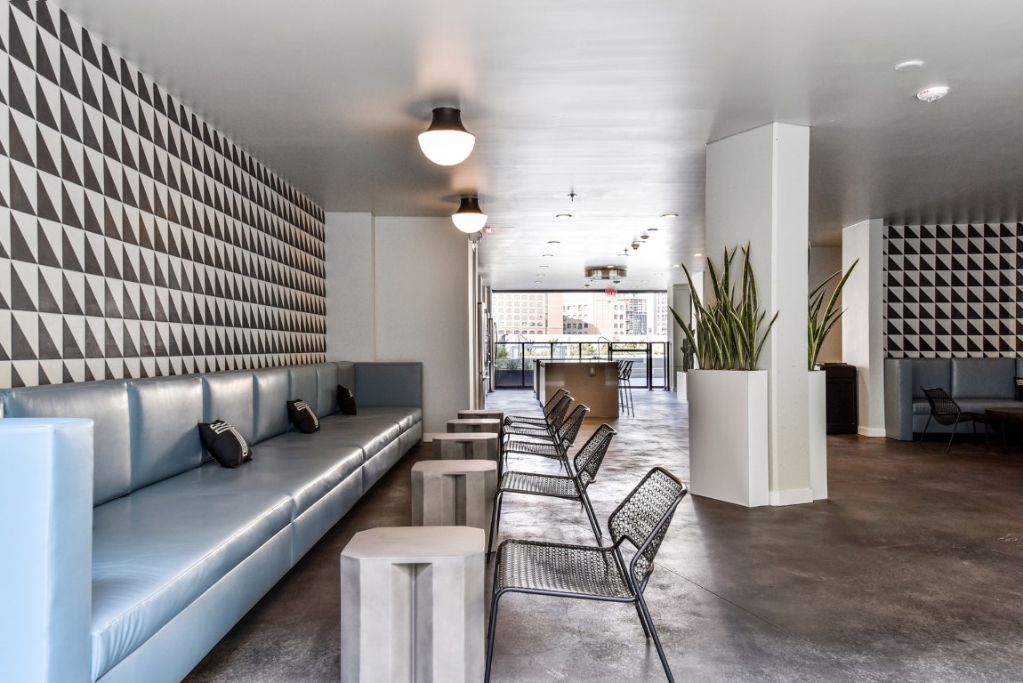 800 Embassy Drive, Unit 609 Austin, TX 78702 - Photo 32 of 33 a dining room with furniture and wooden floor