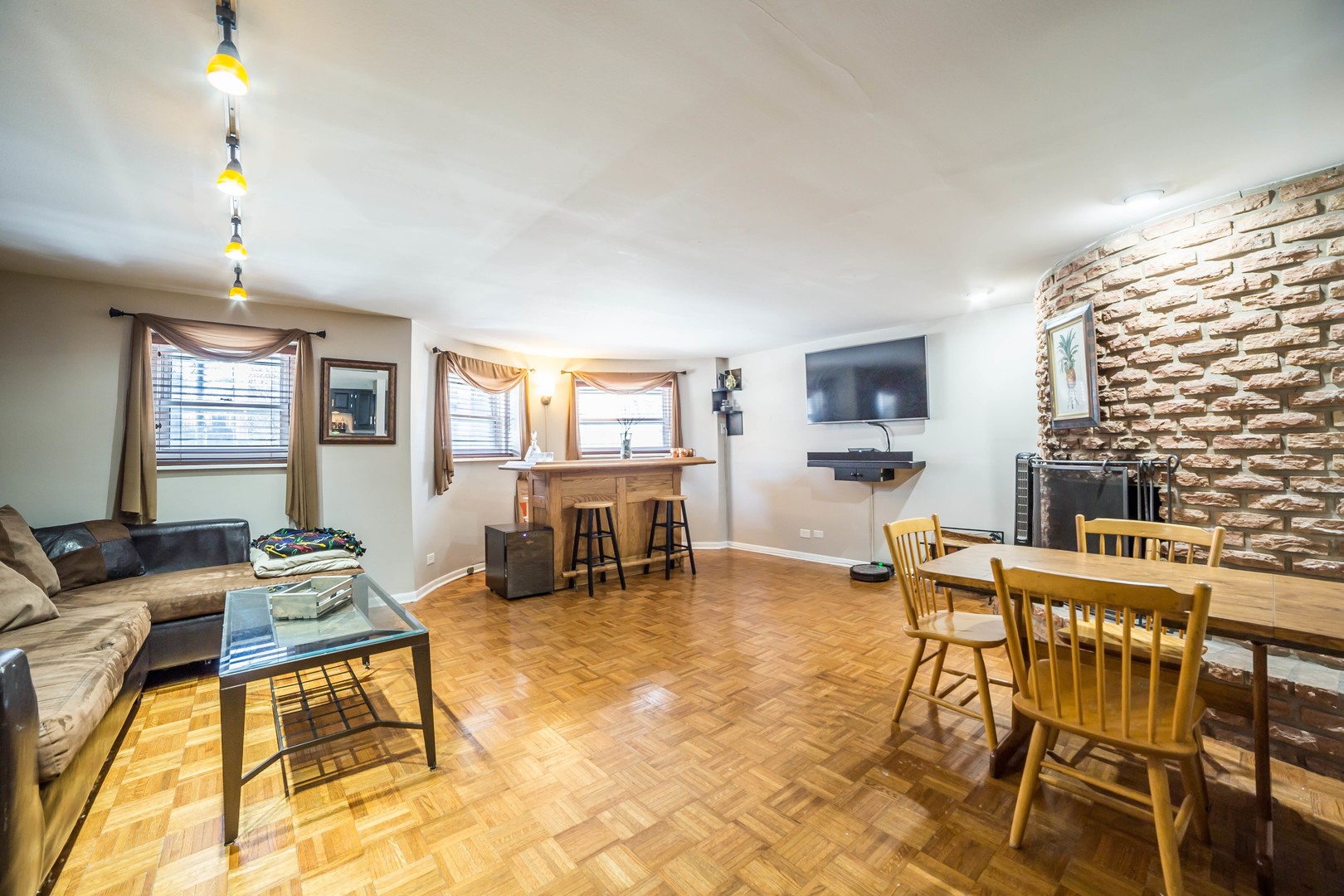 2912 North Halsted Street, Unit G Chicago, IL 60657 - Photo 3 of 11 a living room with furniture and a fireplace