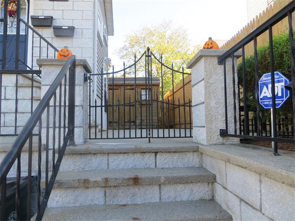 150 Dover Street Fall River, MA 02721 - Photo 1 of 30 a view of entryway with a wooden fence