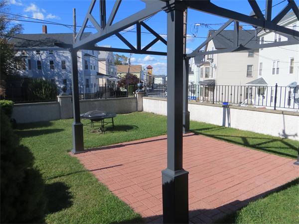 150 Dover Street Fall River, MA 02721 - Photo 29 of 30 a view of a porch with a yard