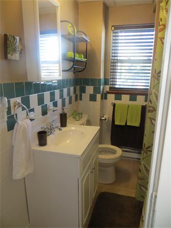 150 Dover Street Fall River, MA 02721 - Photo 5 of 30 a bathroom with a sink a toilet and mirror