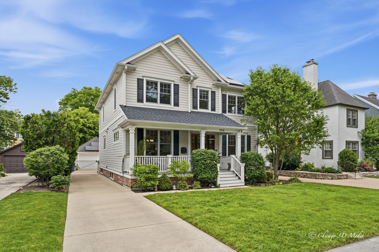 306 17th Street Wilmette, IL 60091 - Photo 1 of 48 a front view of a house with a yard