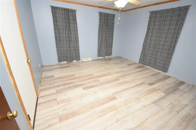 a bedroom with a bed and a mirror