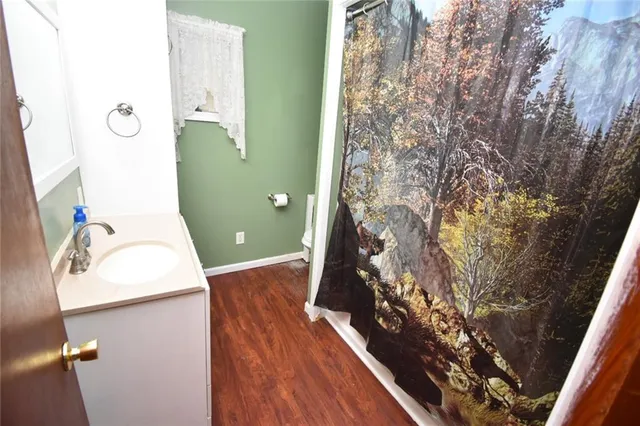 a bathroom with a sink and mirror