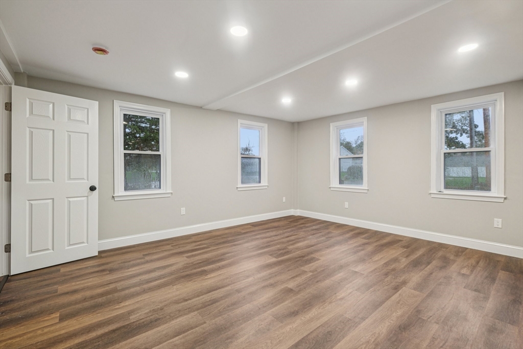 1 Rounseville Road Rochester, MA 02770 - Photo 23 of 42 a view of empty room with wooden floor and fan