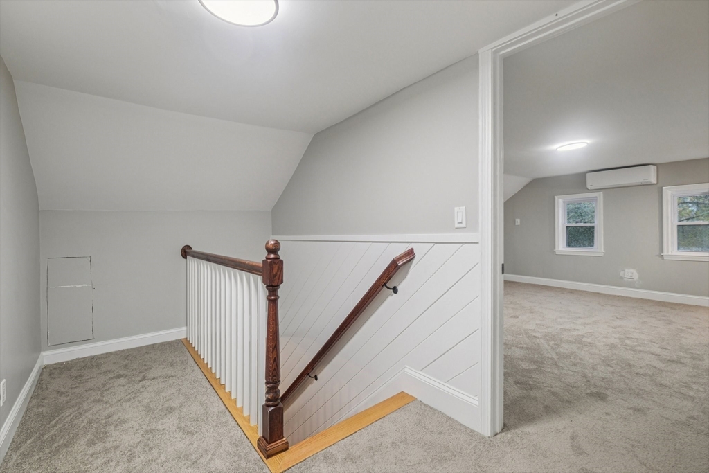1 Rounseville Road Rochester, MA 02770 - Photo 31 of 42 a view of a hallway with white walls and stairs