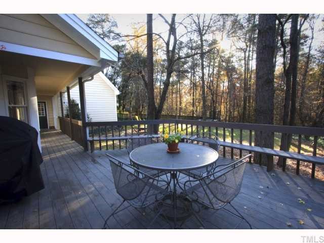 8305 Morgans Way Raleigh, NC 27613 - Photo 10 of 12 a backyard of a house with table and chairs