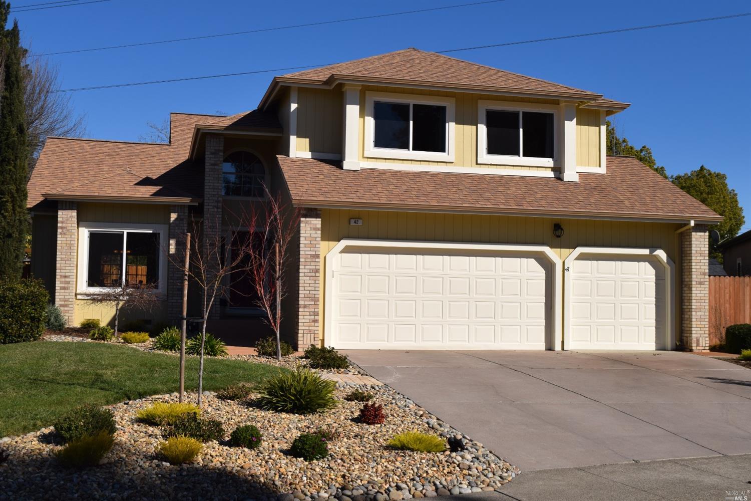 42 Noonan Ranch Circle Santa Rosa, CA 95403 - Photo 1 of 1 a front view of a house with a garden