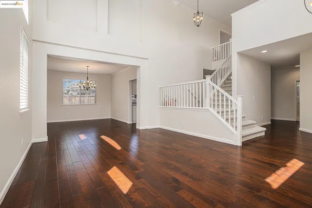 a view of an entryway with wooden floor
