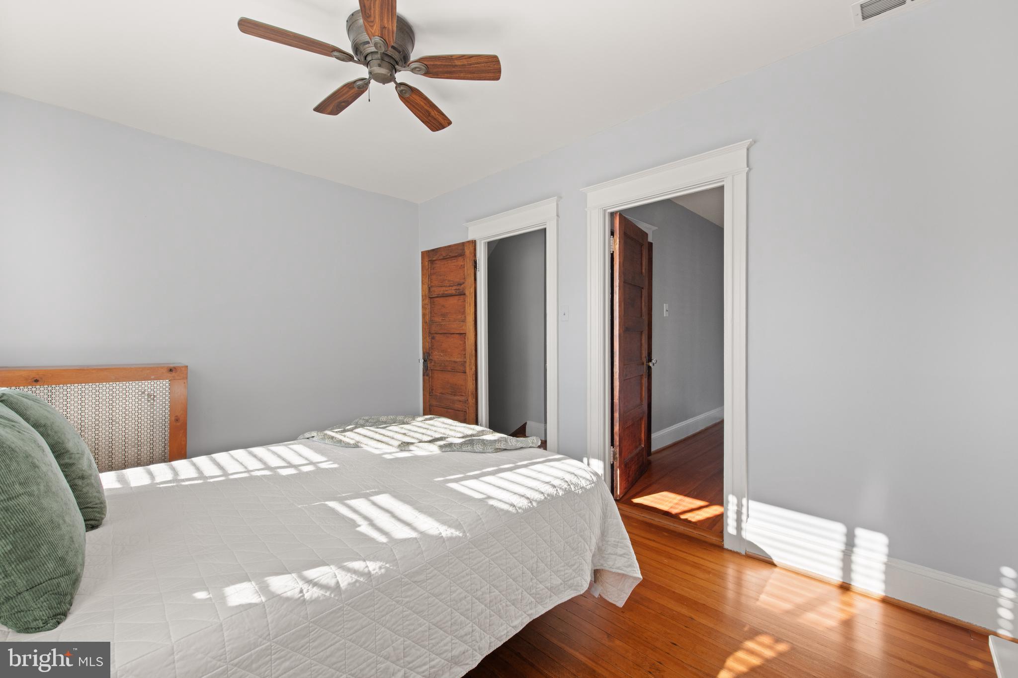 4110 4th Street Northwest Washington, DC 20011 - Photo 28 of 46 a bedroom with a bed and wooden floor