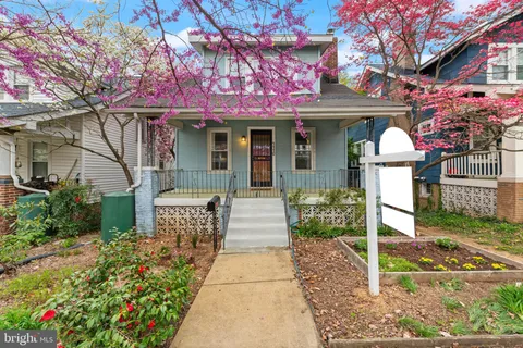 a front view of a building with garden