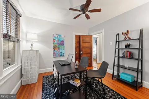a view of a livingroom with furniture and a window