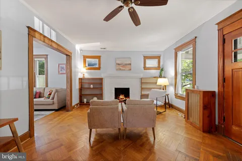a living room with furniture windows and a fireplace
