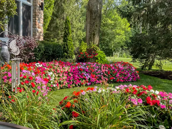 a view of a house with backyard and sitting area