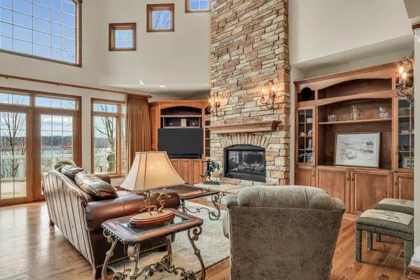 a living room with furniture and a fireplace