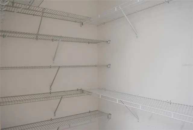 a view of a room with racks on the wall